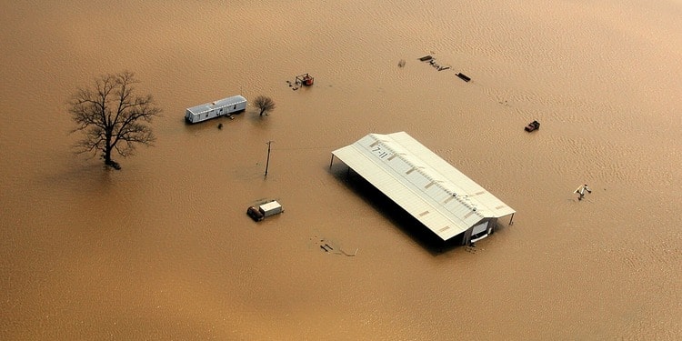 ESG News regarding climate-driven agricultural disruption, extreme weather impacts on commodities, and supply chain risks. Visuals include flooded rubber plantations, farmers navigating waterlogged fields, and maps highlighting affected southern Thailand regions.