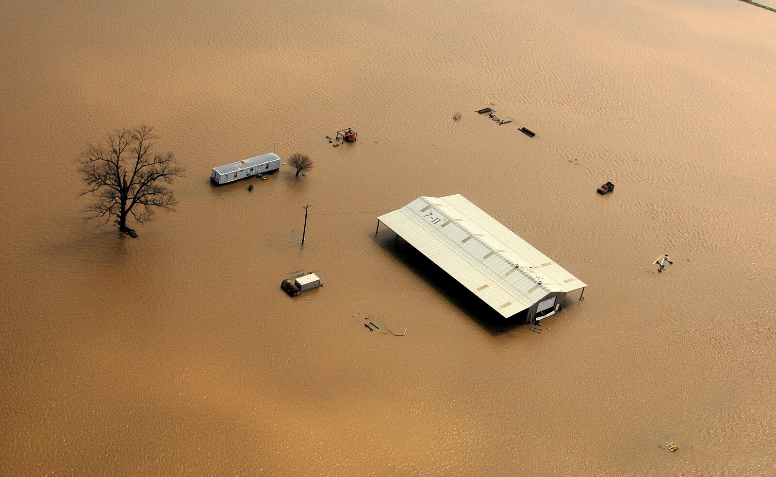 ESG News regarding climate-driven agricultural disruption, extreme weather impacts on commodities, and supply chain risks. Visuals include flooded rubber plantations, farmers navigating waterlogged fields, and maps highlighting affected southern Thailand regions.