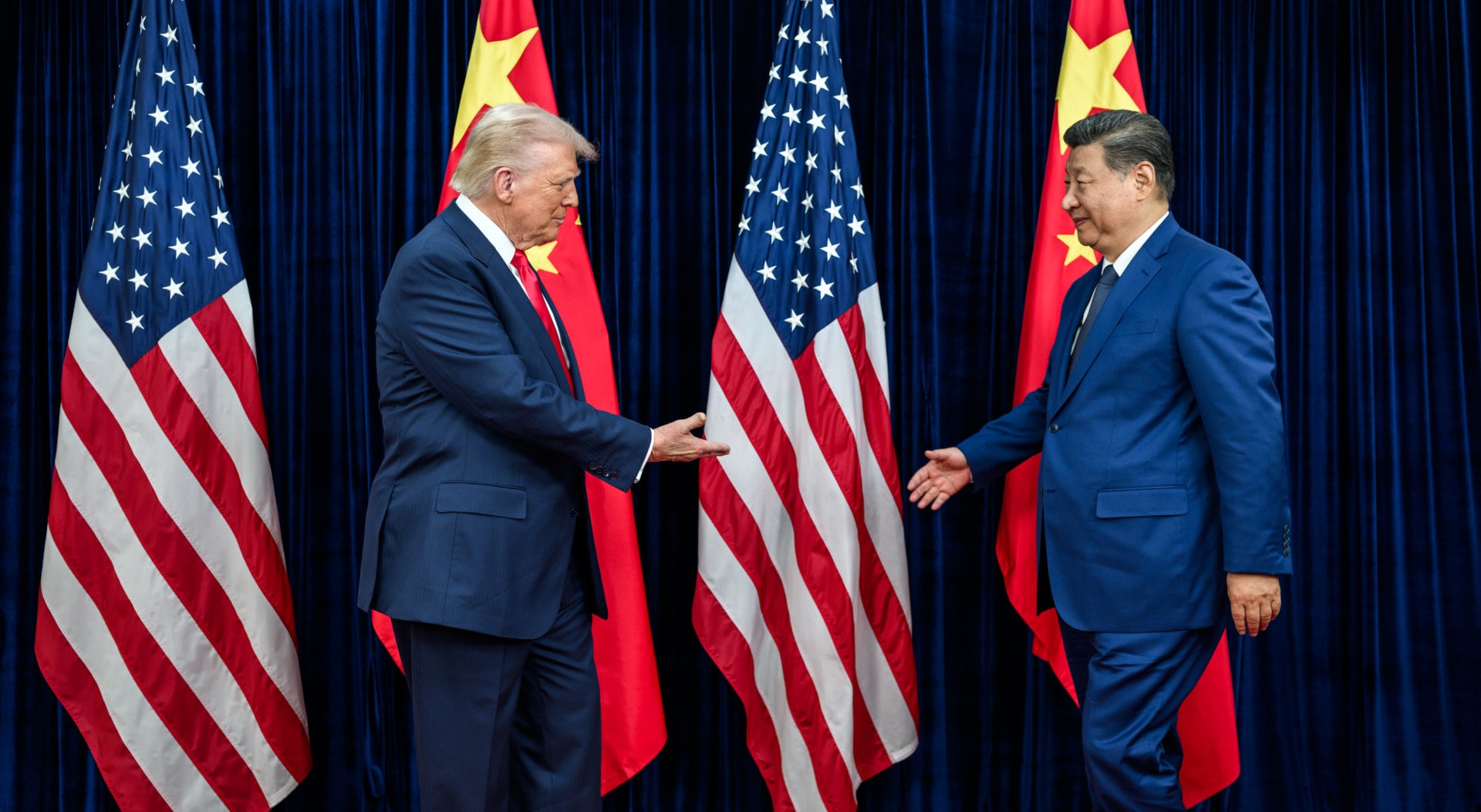 US President Donald Trump greets Chinese President Xi Jinping