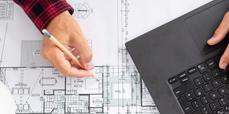 Construction Planning: Top view architect working on his project