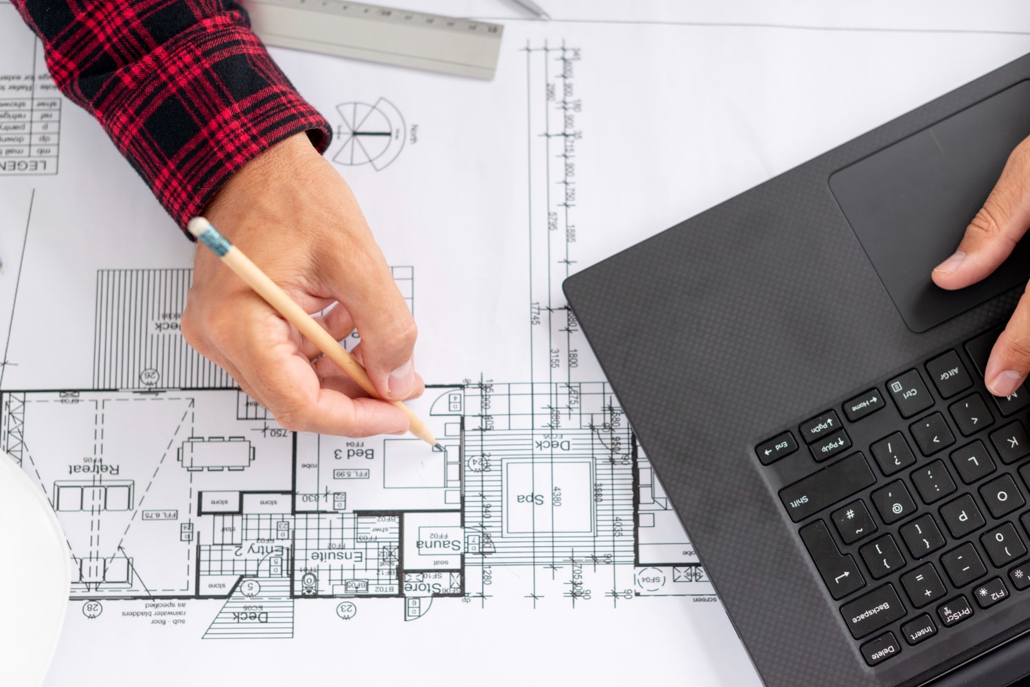 Construction Planning: Top view architect working on his project