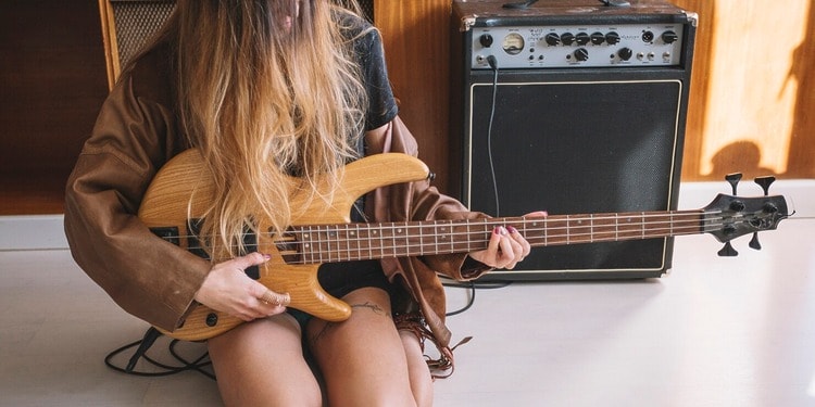 Woman playing an Electro-Acoustic Guitar