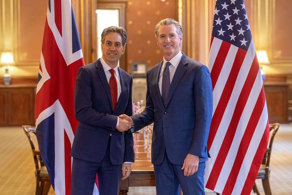 ESG News regarding Trump criticizing Newsom over UK green energy agreement, new analysis questioning the climate benefits of AI, EU greenlighting €1.04 billion Danish programme to reduce farm emissions and restore wetlands, and Santos winning court case over alleged misleading net-zero claims.