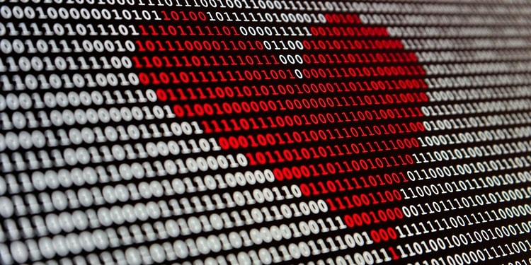 A red heart composed of binary code