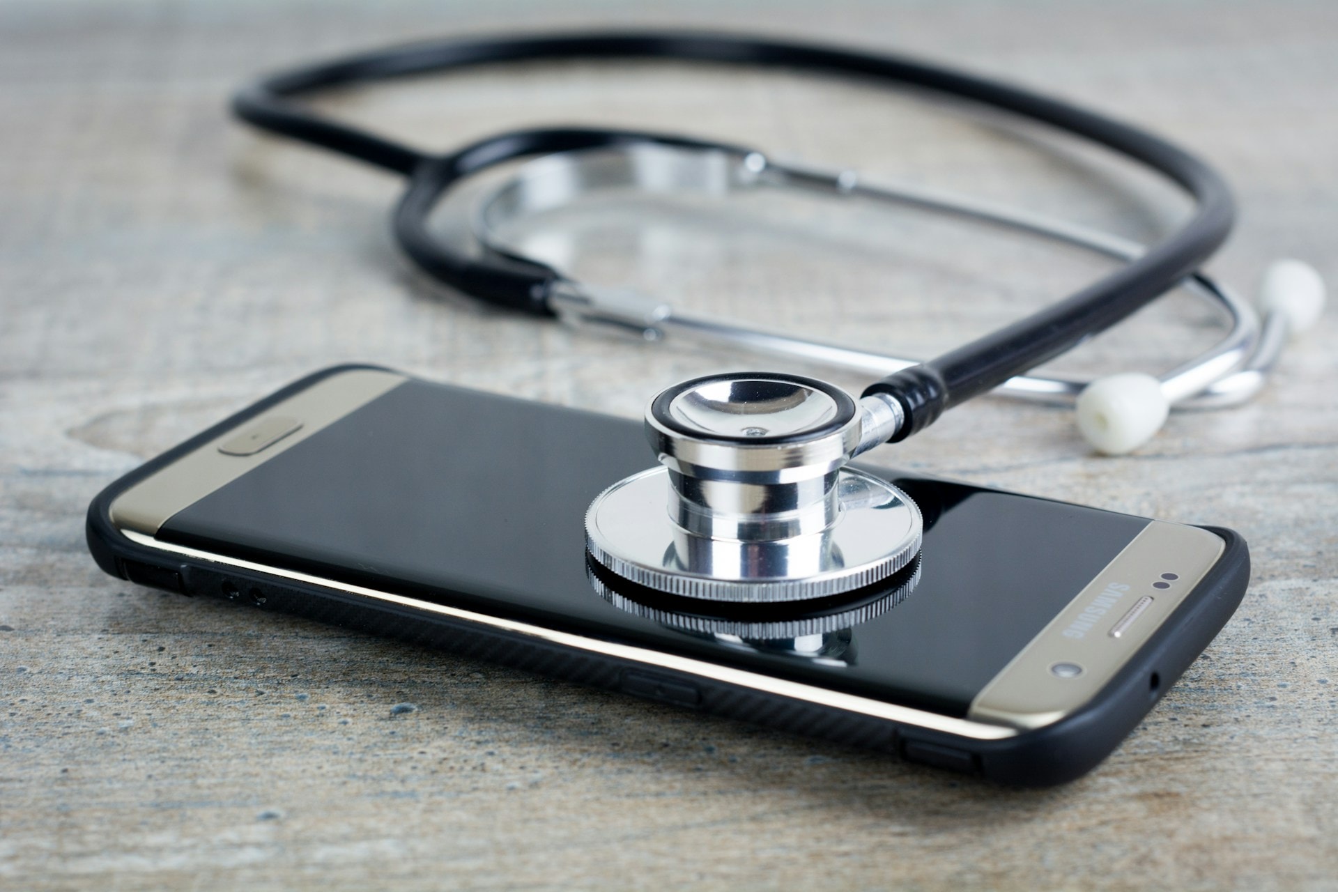 A stethoscope rest on a mobile phone