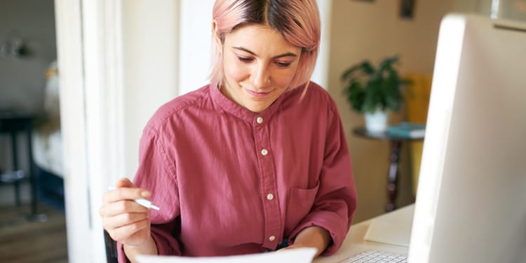A woman going through the checking account guide