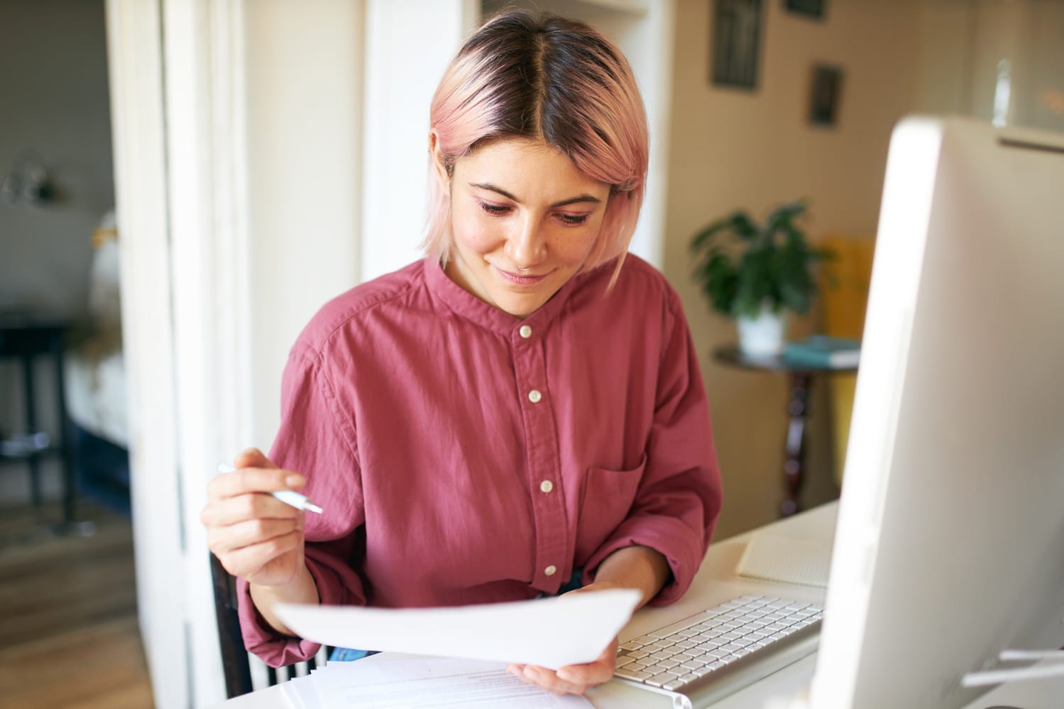 A woman going through the checking account guide