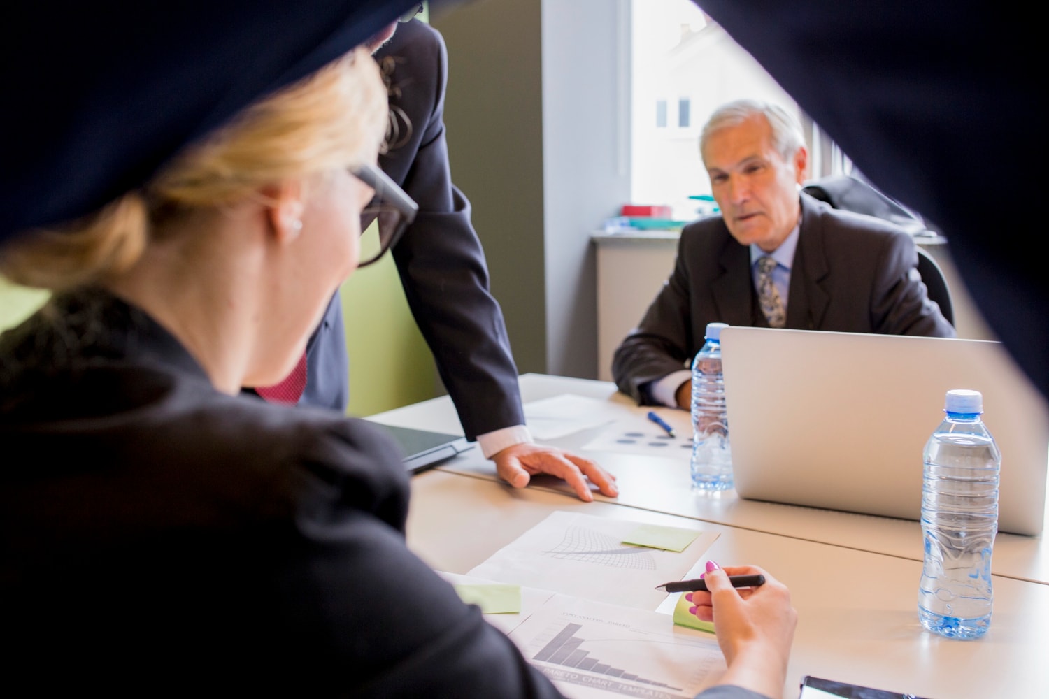 3 Fraud Offences Lawyers in the office going through a case review.