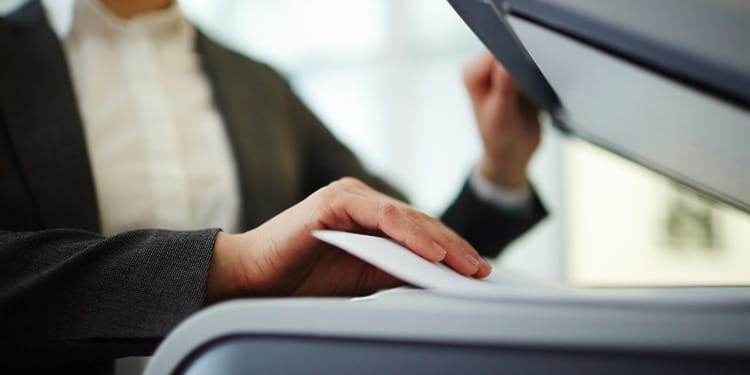 A woman sending a PDF as a Fax From her Computer.