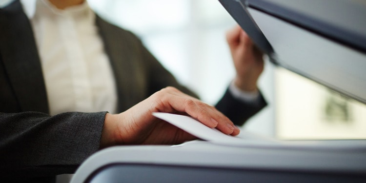 A woman sending a PDF as a Fax From her Computer.