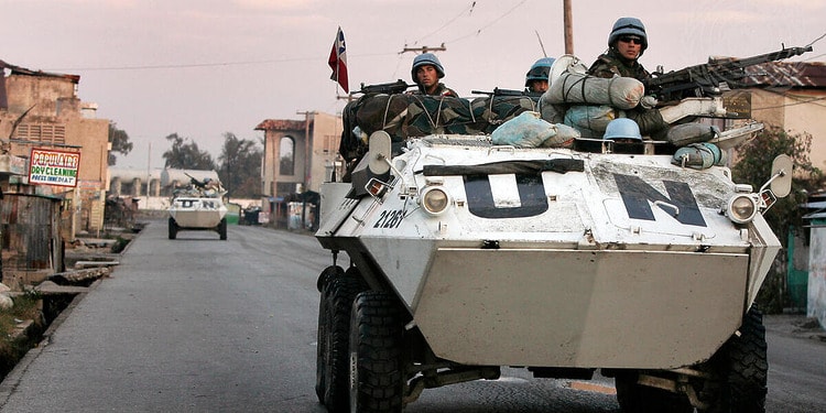Chilean UN peacekeepers patrol the Cité Soleil neighbourhood of Port-au-Prince during an operation to restore order in the area by the United Nations Stabilization Mission in Haiti (MINUSTAH), after three hours of heavy fighting between gangs, Haiti, Feb. 9, 2007. Photo Credit: UN Photo/Logan Abassi