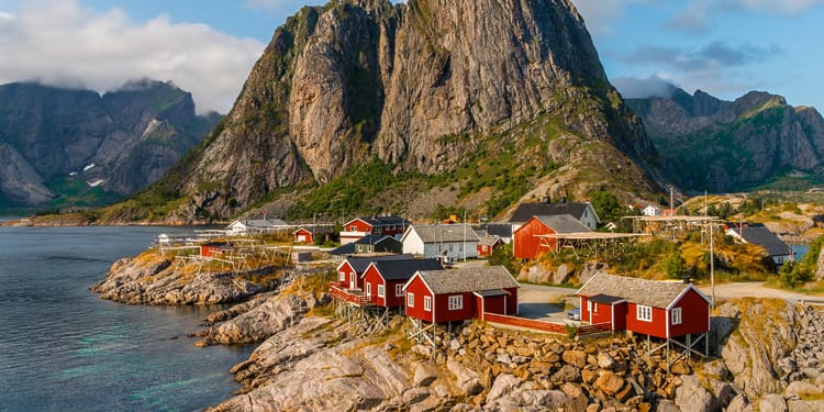 A view of Scandinavia and its eco-friendly travel accommodation on the coastline near Hamnøy, Lofoten islands, Norway
